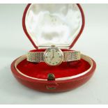 OMEGA 9CT GOLD LADIES WRISTWATCH having integrated 9ct gold strap, the inner back cover marked '