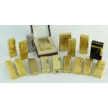 COLLECTION OF CARTIER, DUNHILL & DUPONT CIGARETTE LIGHTERS, mostly gold plated with various textured