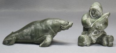 TWO CANADIAN 'AARDVARK' CARVED SOAPSTONE SCULPTURES of walrus, 21cms long and Eskimo, 12cms high (2)