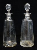 PAIR MALLET SHAPED CLEAR GLASS SPIRIT DECANTERS of tapering conical form with star-cut bases, each