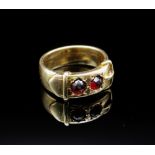 YELLOW METAL BELT BUCKLE DESIGN RING, set with two probably garnet stones, hallmarked '20' 'WH',