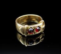 YELLOW METAL BELT BUCKLE DESIGN RING, set with two probably garnet stones, hallmarked '20' 'WH',