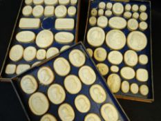 COLLECTION 90 GRAND TOUR PLASTER MEDALLIONS OF CAMEOS, fixed in three paper-lined shallow tray boxes