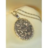 9CT GOLD OVAL LOCKET, scroll engraved, on 9ct gold fine chain, 60cms long, 12.4gms overall