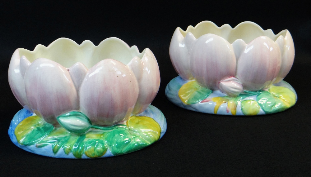 TWO CLARICE CLIFF LOTUS BULB POTS, one Newport Pottery, the other Royal Staffordshire, 13cms high