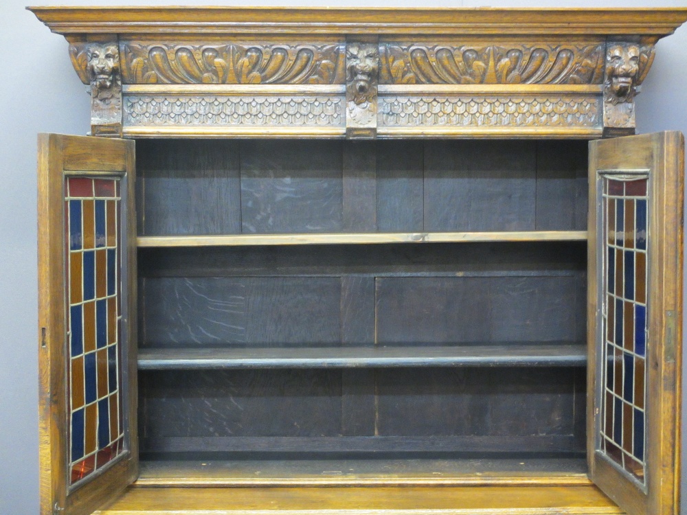 CONTINENTAL STYLE CARVED OAK BOOKCASE SIDEBOARD - with leaded coloured glass upper doors, lion mask, - Image 7 of 11