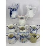 ANTIQUE RELIEF MOULDED JUGS (9) - all having cherubic decoration with flow blue, lustre and