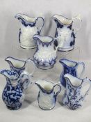 VICTORIAN FLOW BLUE & LUSTRE HIGHLIGHTED JUGS (8) - most having patterns in relief depicting