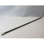 VICTORIAN EBONIZED WALKING CANE with unmarked white metal top, domed with multi-sectional floral