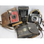 VINTAGE CAMERAS (3) to include a Kodak Junior No 1 bellows camera, cased, a red Brownie, cased,