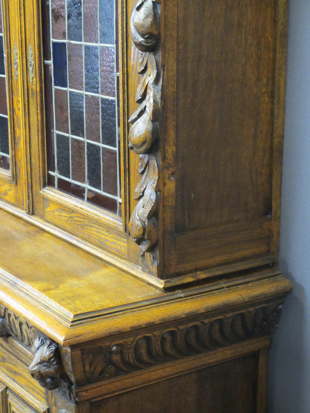 CONTINENTAL STYLE CARVED OAK BOOKCASE SIDEBOARD - with leaded coloured glass upper doors, lion mask, - Image 5 of 11