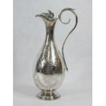 SILVER WINE FLAGON - on a circular step base, narrow neck, hinged lid, scrolled handle and all