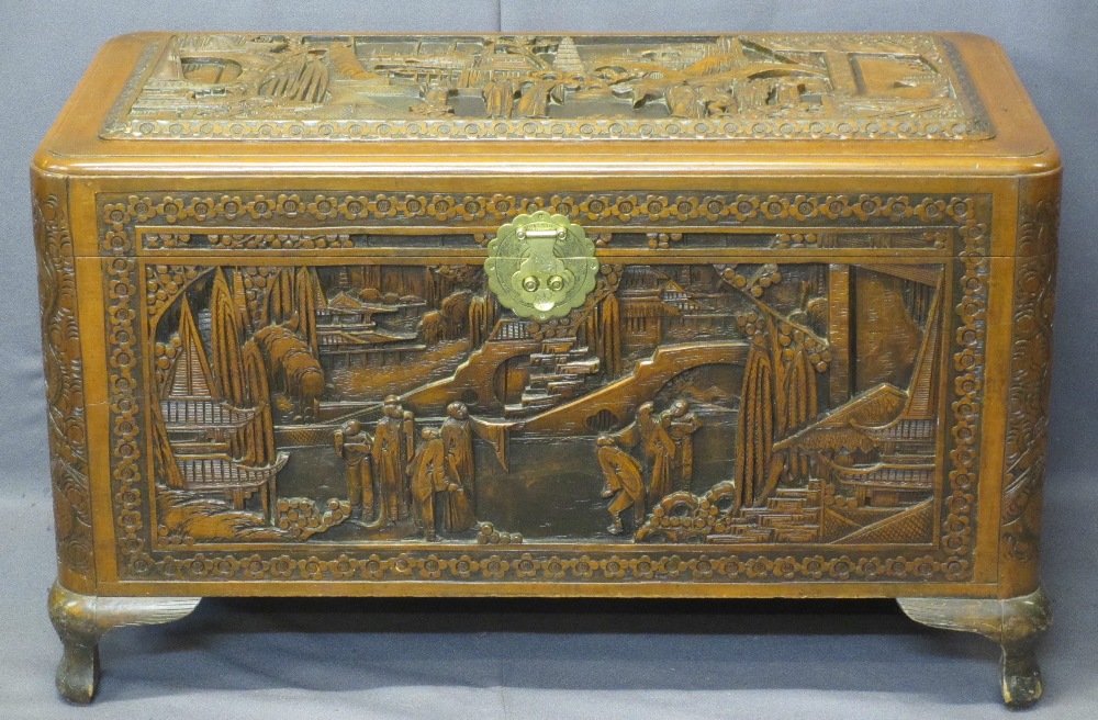 CHINESE CAMPHORWOOD LIDDED CHEST - deep carved pagodas and people in garden settings, original brass