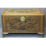 CHINESE CAMPHORWOOD LIDDED CHEST - deep carved pagodas and people in garden settings, original brass