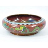 A CIRCULAR EARLY 20TH CENTURY CLOISONNE SHALLOW BOWL - 24cms diameter, 8cms H, decorated with blue