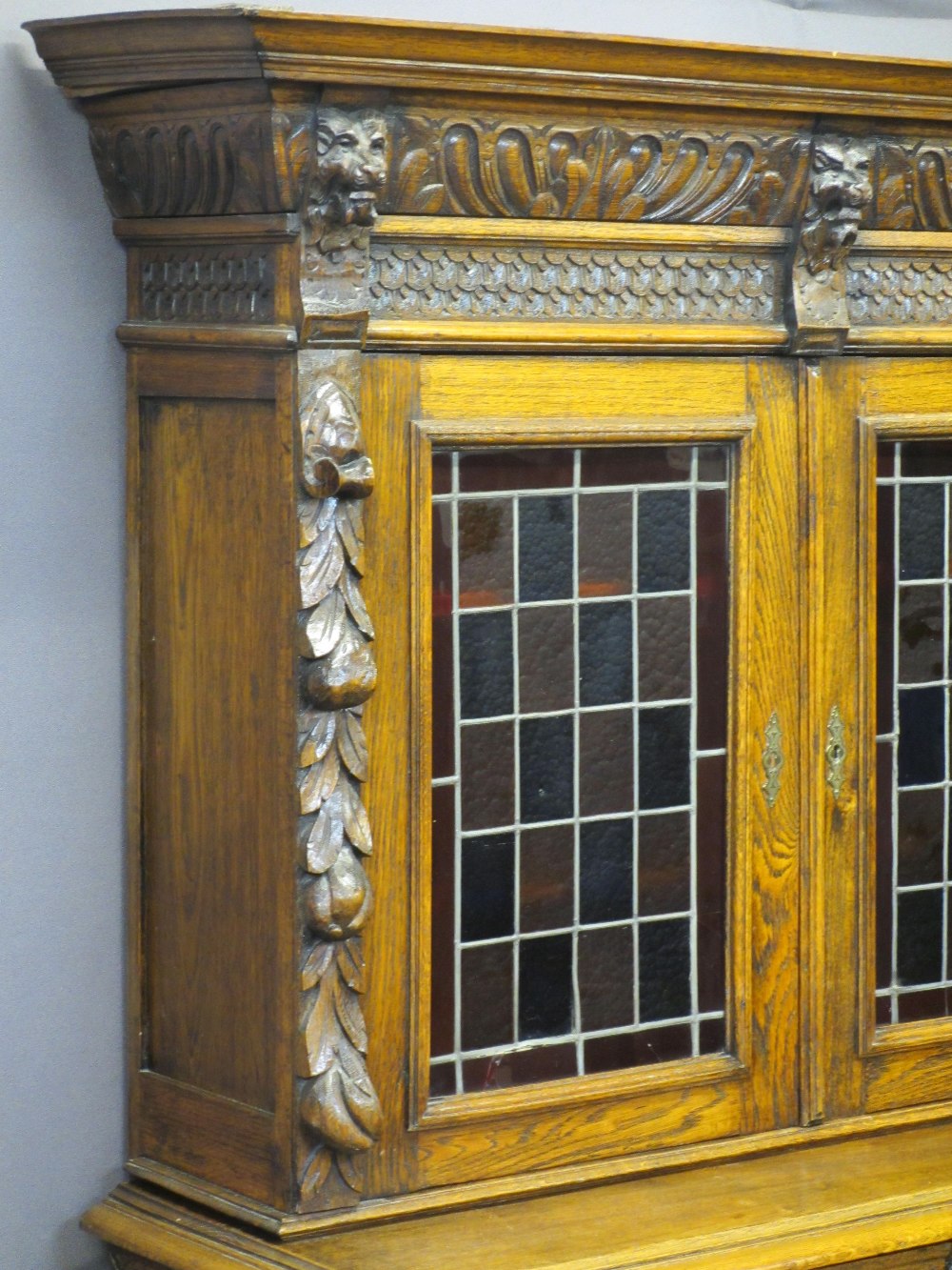 CONTINENTAL STYLE CARVED OAK BOOKCASE SIDEBOARD - with leaded coloured glass upper doors, lion mask, - Image 2 of 11