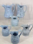 VICTORIAN RELIEF MOULDED JUGS (6) - all blue ground, four having sleeping/playful cherubs, the other