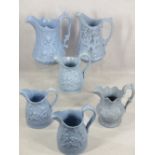 VICTORIAN RELIEF MOULDED JUGS (6) - all blue ground, four having sleeping/playful cherubs, the other