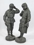 CAST SPELTER FIGURINES, A PAIR - a young schoolgirl and boy on circular bases, no visible signatures