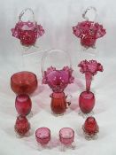 CRANBERRY GLASSWARE - 12 pieces to include three frilly edge baskets with handles, twin handled