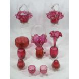 CRANBERRY GLASSWARE - 12 pieces to include three frilly edge baskets with handles, twin handled