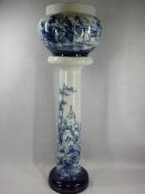 VICTORIAN BLUE & WHITE POTTERY JARDINIERE & STAND having hand painted decorations depicting old