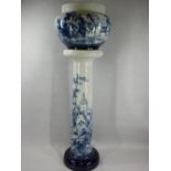 VICTORIAN BLUE & WHITE POTTERY JARDINIERE & STAND having hand painted decorations depicting old