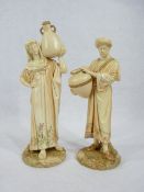 ROYAL WORCESTER FIGURINES, A PAIR - depicting male and female water carriers, Model Nos 1250,