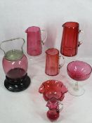 CRANBERRY GLASSWARE, 7 ITEMS - three graduated jugs, 19cms H the largest, biscuit barrel with plated