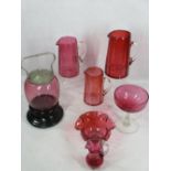 CRANBERRY GLASSWARE, 7 ITEMS - three graduated jugs, 19cms H the largest, biscuit barrel with plated