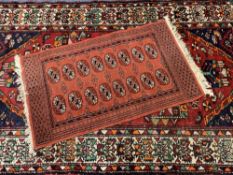 VINTAGE EASTERN RUGS (2) - a fine Bukhari rug, red ground with repeating central block pattern and