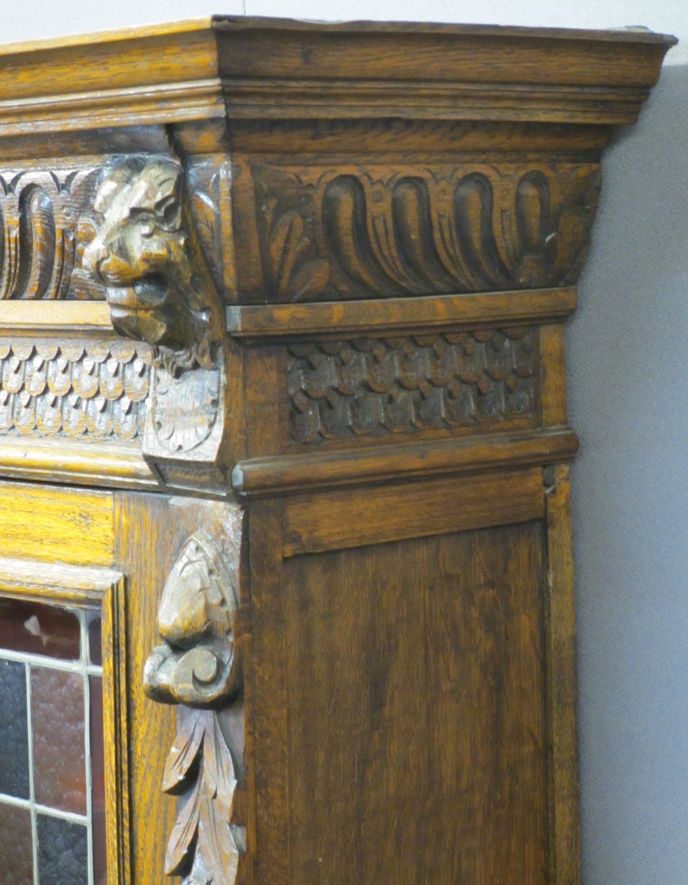 CONTINENTAL STYLE CARVED OAK BOOKCASE SIDEBOARD - with leaded coloured glass upper doors, lion mask, - Image 4 of 11