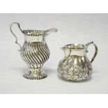 A WILLIAM IV SILVER CREAM JUG - the body of swirled form, 2 ozt, London 1848 and a squat silver