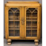 GOOD HONEY OAK ART DECO BOOKCASE - railback with central reeded and carved panel and flanking glazed