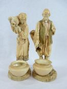 LARGE PAIR OF ROYAL WORCESTER FIGURINES BY JAMES HADLEY - depicting an Eastern man and woman in