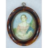 A WATERCOLOUR MINIATURE ON BONE - a lady in a pink dress and pink rose in her hair, oval format, 8 x