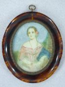 A WATERCOLOUR MINIATURE ON BONE - a lady in a pink dress and pink rose in her hair, oval format, 8 x