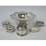 A SILVER PETAL PATTERNED DISH ON A SHORT PEDESTAL, 3.8 ozt, Birmingham 1944 and five silver napkin