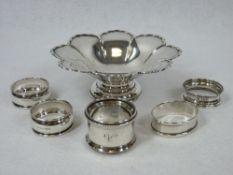 A SILVER PETAL PATTERNED DISH ON A SHORT PEDESTAL, 3.8 ozt, Birmingham 1944 and five silver napkin