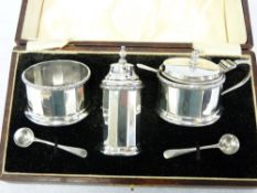 A CASED THREE PIECE SALT & PEPPER CONDIMENT SET (one blue glass liner missing), each piece of