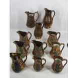 VICTORIAN COPPER LUSTRE JUGS (11) - having painted relief moulded floral detail in the main, two
