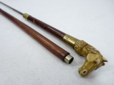 VINTAGE SWORD STICK with ivorine horse's head handle and brass collars to the shaft, the squared