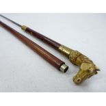 VINTAGE SWORD STICK with ivorine horse's head handle and brass collars to the shaft, the squared