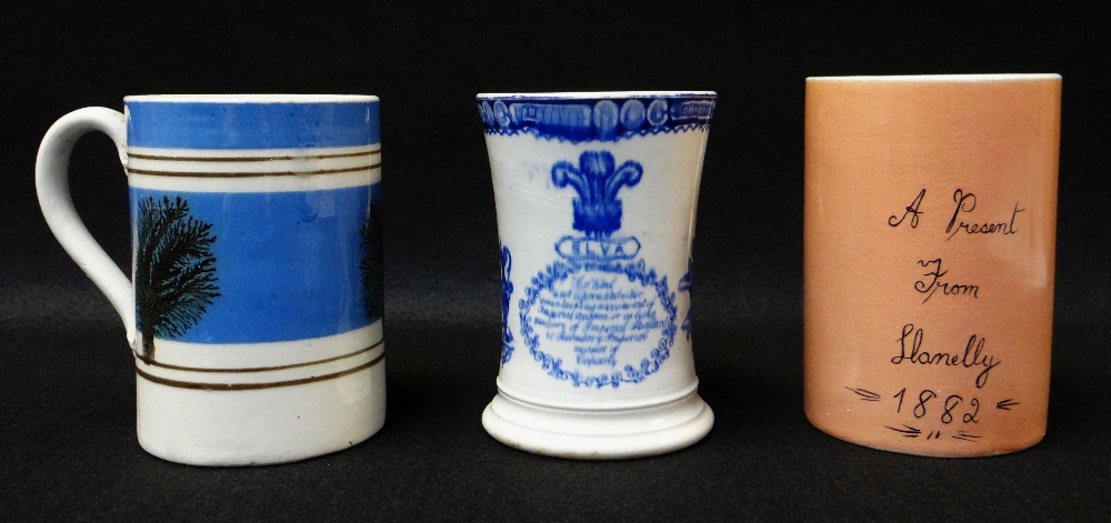 THREE LLANELLY MUGS including a mocha ware pint measure, decorated with sponged trees to coloured