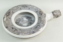 A RARE LLANELLY POTTER BEDPAN IN THE MILAN TRANSFER of wheel form with nozzle, the interior with a