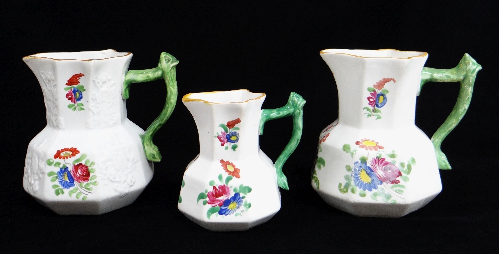 FIVE SWANSEA POTTERY JUGS including graduated trio, all with green twig-handles, enamelled flowers - Image 3 of 3