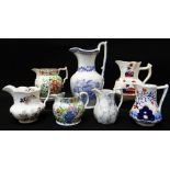 SEVEN VARIOUS WELSH POTTERY JUGS including named Swansea floral decorated jug for 'John Jenkins