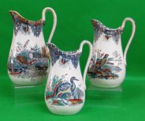 GRADUATED TRIO OF SWANSEA POTTERY JUGS IN THE 'BIRDS' TRANSFER with birds in natural surroundings,