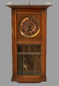 VINTAGE OAK CASED WALL CLOCK, the copper dial enamelled with semi-stylized numerals over a