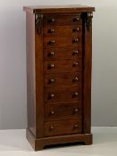 VICTORIAN MAHOGANY WELLINGTON CHEST of nine opening drawers with turned wooden knobs, on a plinth